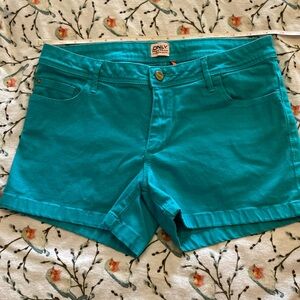 Only brand denim shorts.